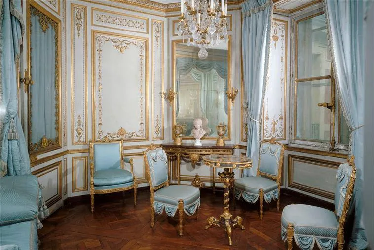 Marie-Antoinette's private apartment at Versailles: a typically Louis XVI intimate setting, with painted woodwork and refined furniture.