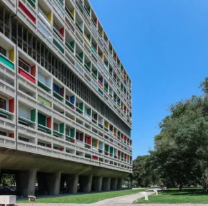 Facade of the Unité d'Habitation, pilotis and colored loggias.