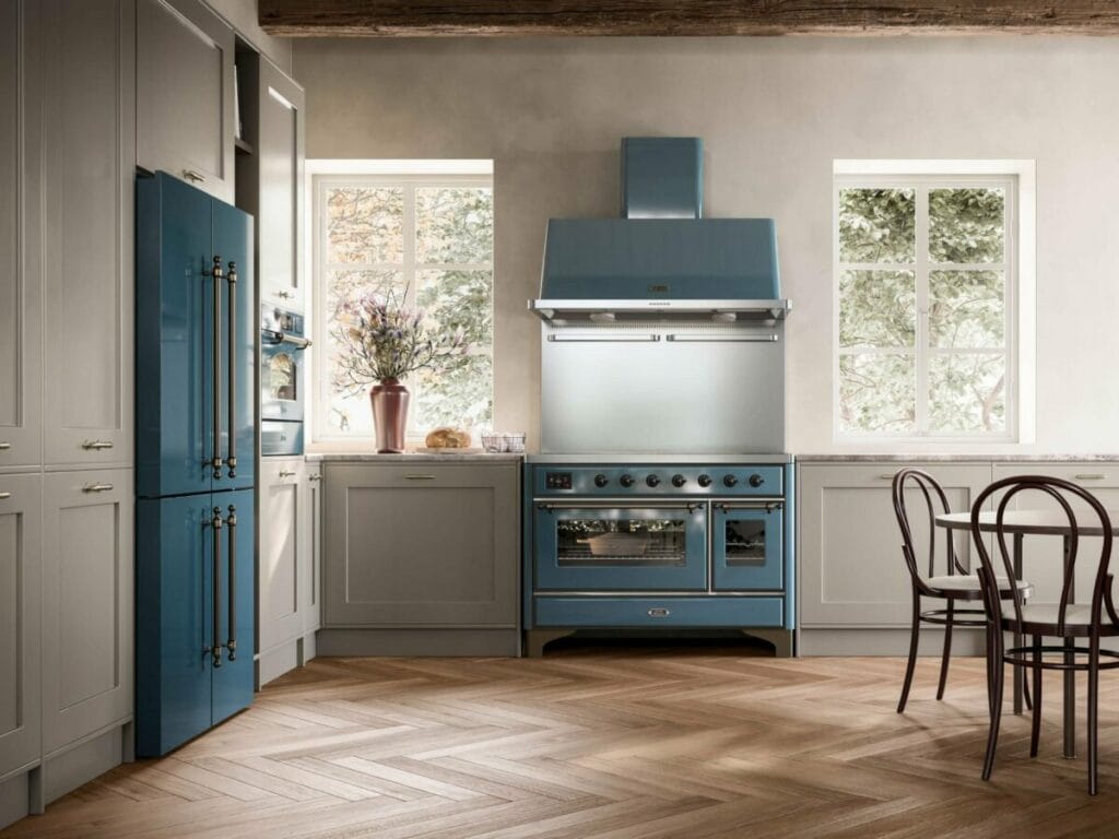 ILVE Majestic 90 cm range cooker in sky blue with brass finishes in an elegant classic contemporary kitchen.