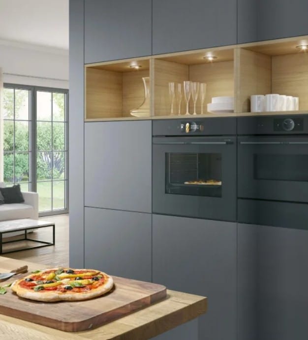 Bosch Series 8 built-in oven with black glass facade and digital control in a modern kitchen.