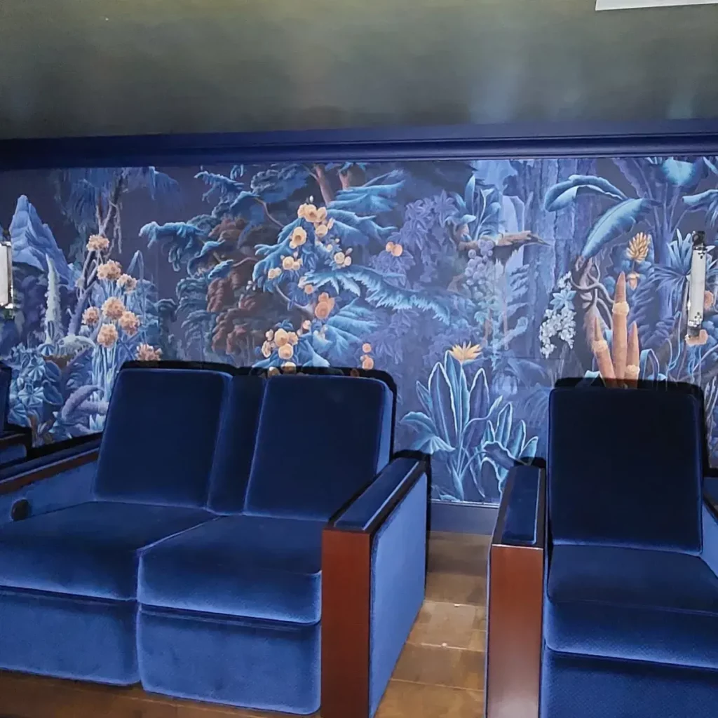 Bespoke cinema room with patterned velvet fabric walling