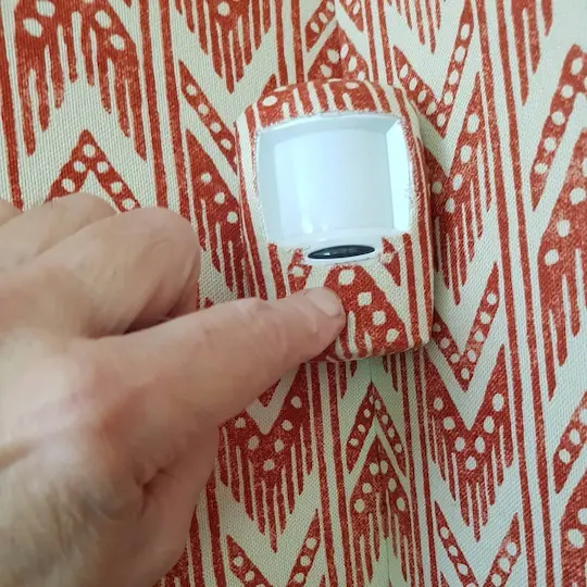 Fabric walling detail around electrical outlet socket