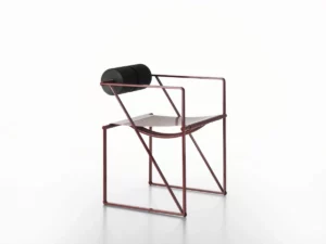 Le fauteuil Seconda (1982) de Mario Botta pour Alias : structure en acier laqué, assise en tôle perforée et dossier constitué de deux cylindres en polyuréthane — un design minimal et architecturé.