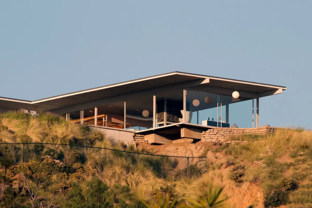 Glazed facade of the Stahl House (CSH #22) overlooking Los Angeles, at night.
