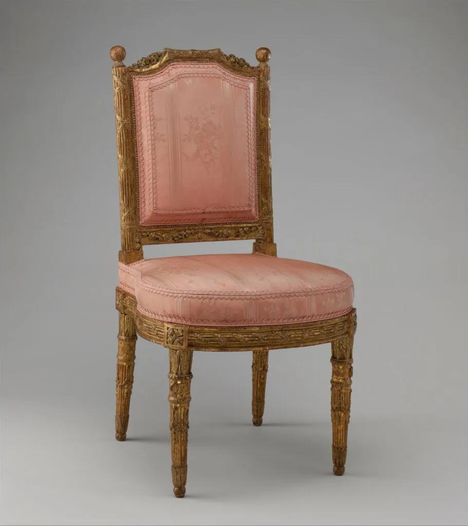 Louis XVI style à la reine chair, flat back and straight apron, tapered fluted legs, gilded wood, circa 1784