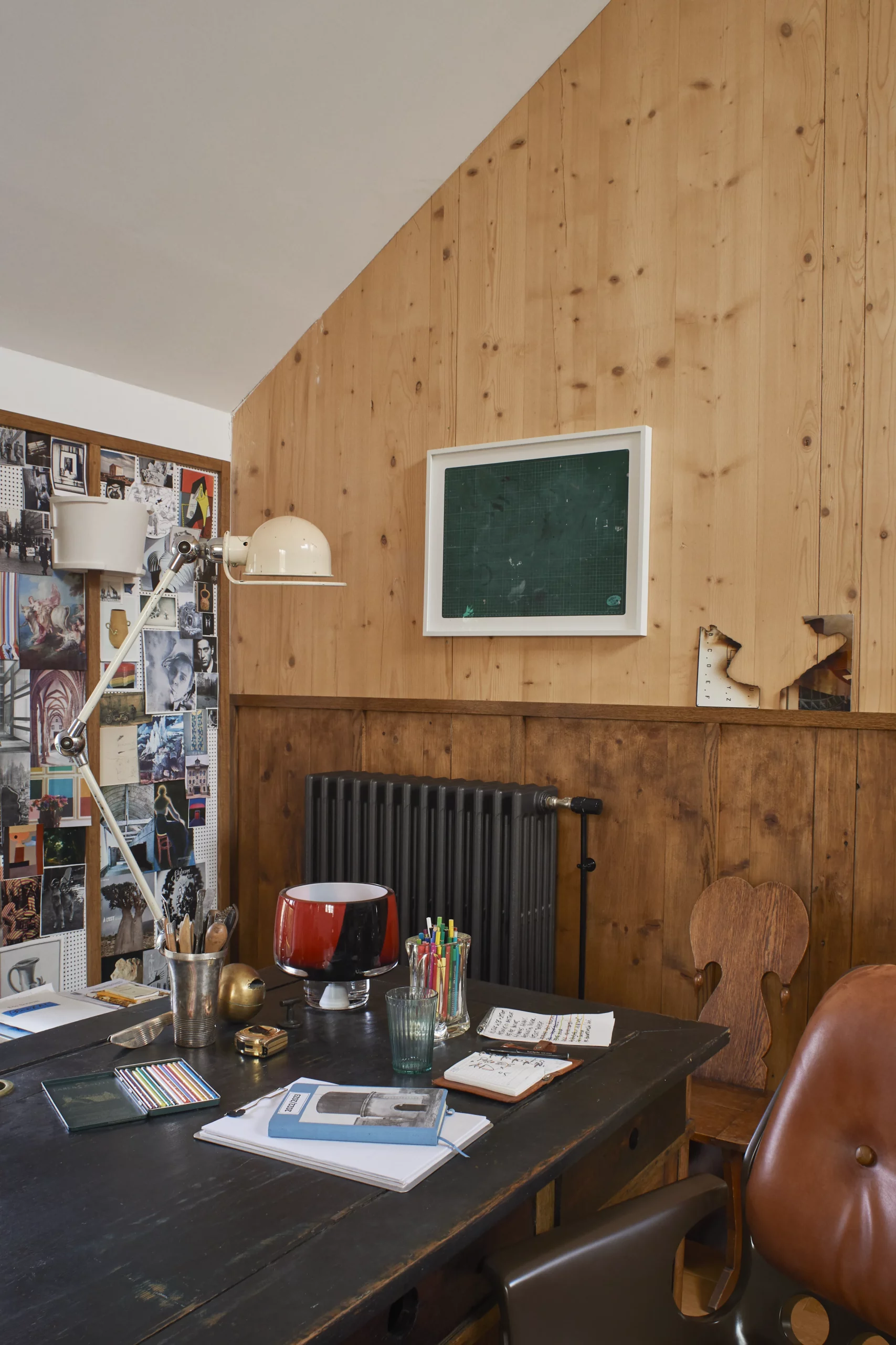 Study and studio of Eric Schmitt at Le Chapitre with antique Romanian wood desk