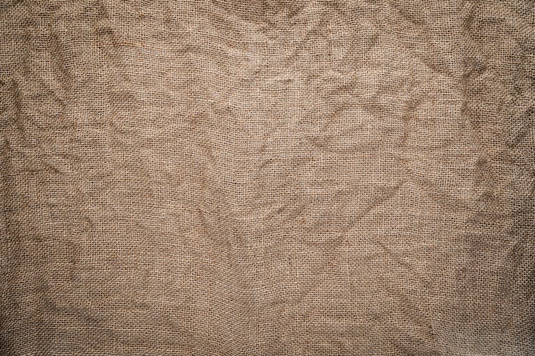 High-resolution image of crumpled burlap fabric showing detailed texture and pattern.